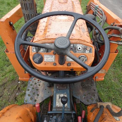 142 - A Kubota B7001, starts runs and drives, comes with Hymari power loader and a 3.5ft bucket, hours not... 