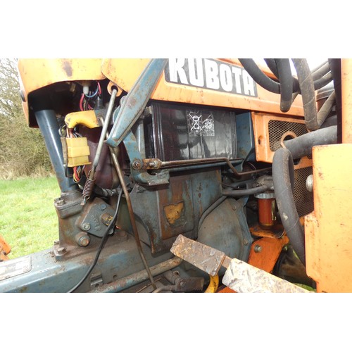 142 - A Kubota B7001, starts runs and drives, comes with Hymari power loader and a 3.5ft bucket, hours not... 