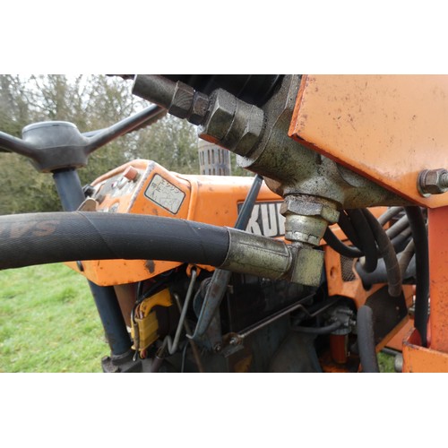 142 - A Kubota B7001, starts runs and drives, comes with Hymari power loader and a 3.5ft bucket, hours not... 