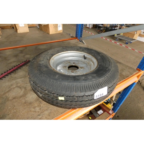 5184 - 1 x metal four stud trailer wheel with a 5.00-10 tyre fitted