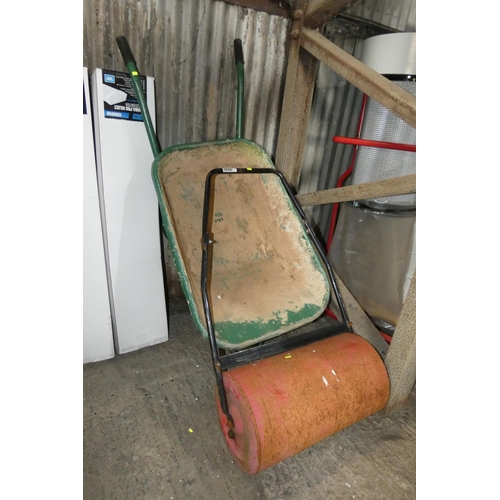 5606 - 1 x green metal wheelbarrow (requires tube / tyre) and 1 x garden roller approx 57cm wide (fill with... 