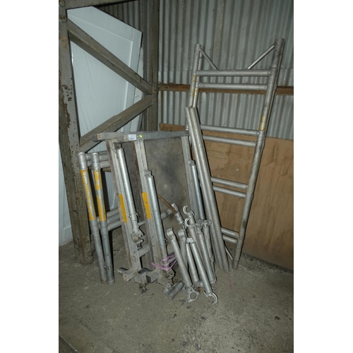 5644 - An alloy multi section scaffold tower including 4 x end sections, braces and 2 x platforms. Footprin... 