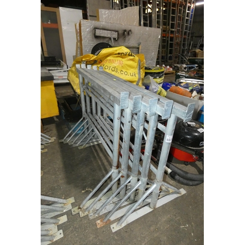 5973 - 5 x galvanised metal adjustable height trestles