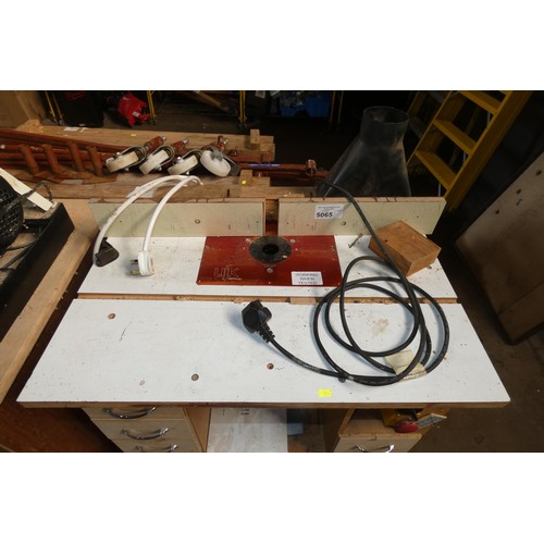 5065 - 1 x UJK Technology router bench fitted with a Freud router 240v and supplied with various router bit... 