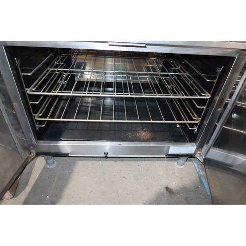 2199 - A commercial stainless steel solid top range with 2 door oven beneath gas - trade