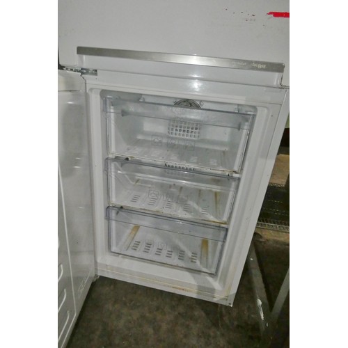 2173 - A white household fridge freezer by Beko - trade. Tested Working