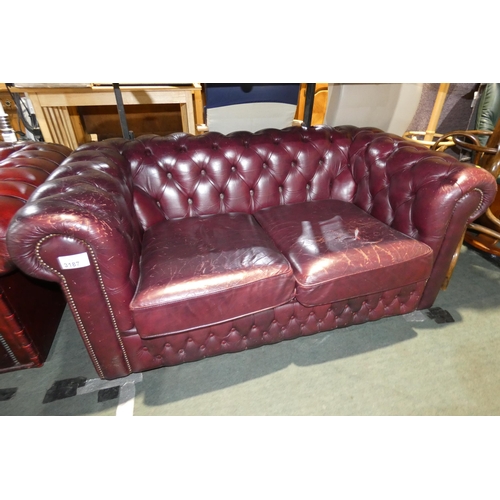 3187 - A Chesterfield style deep burgundy upholstered button back sofa approx 155cm wide. Please note that ... 