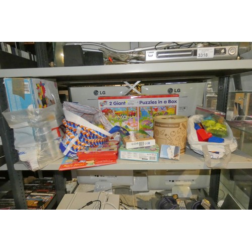 3319 - A quantity of learning aids, puzzles, building blocks etc, contents of 1 shelf