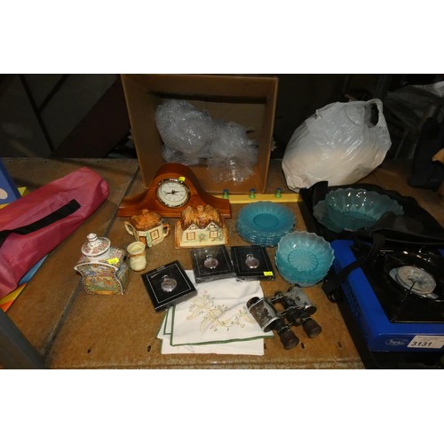 3131 - A quantity of various items including a camping gas stove, a non slip ice mat, a mantle clock, crock... 