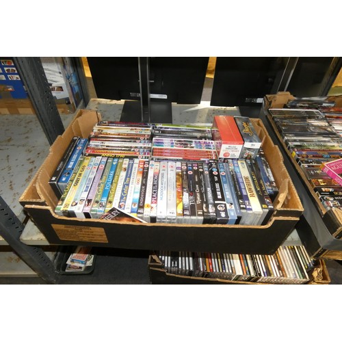 3321 - A large quantity of various DVDs & CDs, contents of 4 shelves