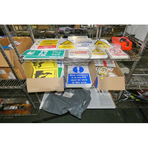 3610 - A quantity of various health and safety signs and tape, contents of 3 shelves