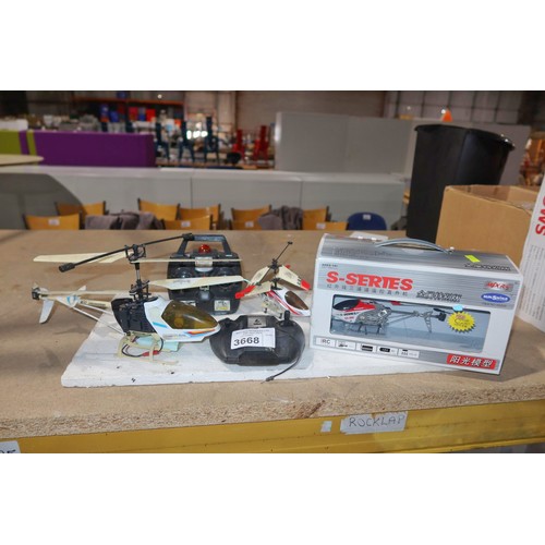 3668 - 1 x Sunshine SS200 radio controlled model helicopter (boxed, appears to be unused and 1 x handheld t... 