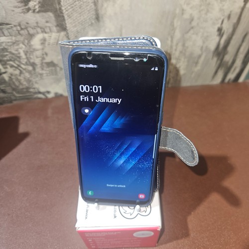 3398 - A used Samsung Galaxy S8 factory reset, previous owner removed, comes with power adapter, SIM remove... 