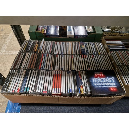 3324 - A quantity of various DVDs and CDs box sets etc. Contents of 3 shelves