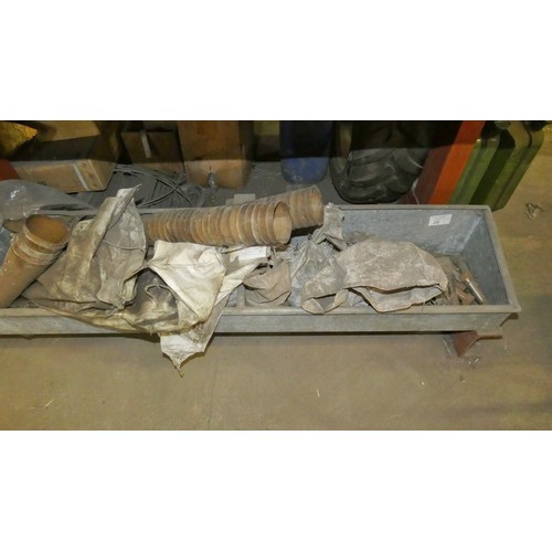 26 - A galvanised metal feed tray approx 365cm long containing a quantity of various items including hold... 