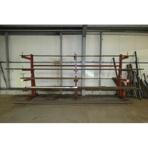 97 - A three section five tier cantilever steel storage rack containing a quantity of stock steel includi... 