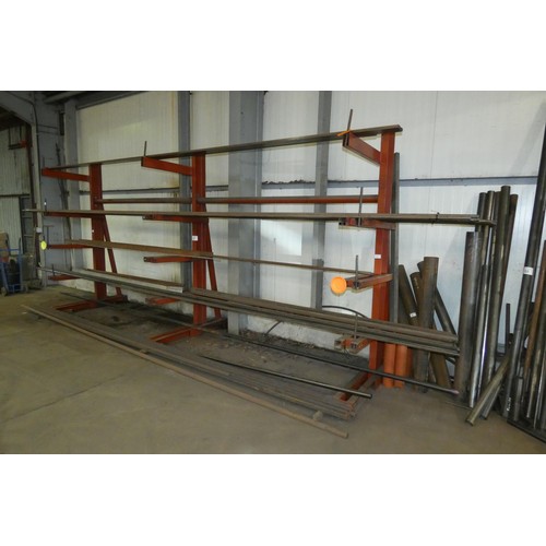 97 - A three section five tier cantilever steel storage rack containing a quantity of stock steel includi... 