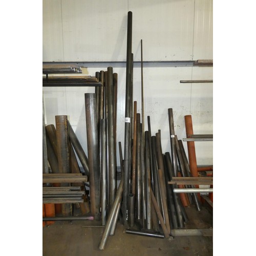 98 - A quantity of various steel tube off cuts - leaning against the wall between the two cantilever stor... 