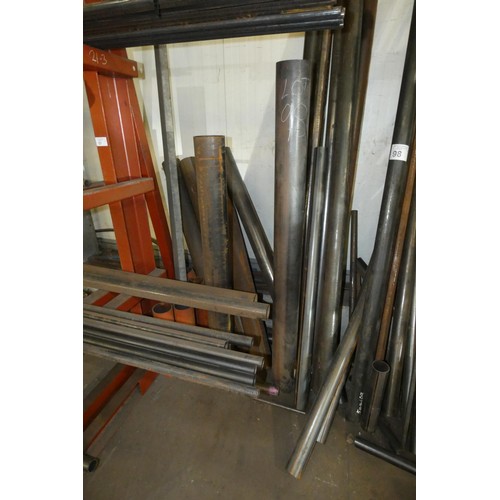 98 - A quantity of various steel tube off cuts - leaning against the wall between the two cantilever stor... 