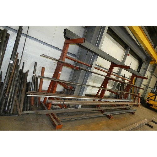 99 - A three section five tier cantilever steel storage rack containing a quantity of stock steel includi... 