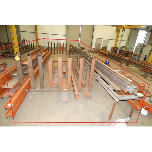 115 - A large vertical post stock steel storage rack welded to a 12m long roller conveyor unit. This lot i... 