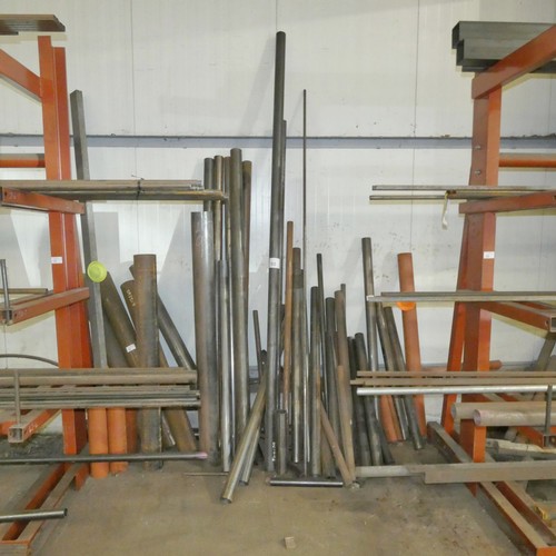 98 - A quantity of various steel tube off cuts - leaning against the wall between the two cantilever stor... 