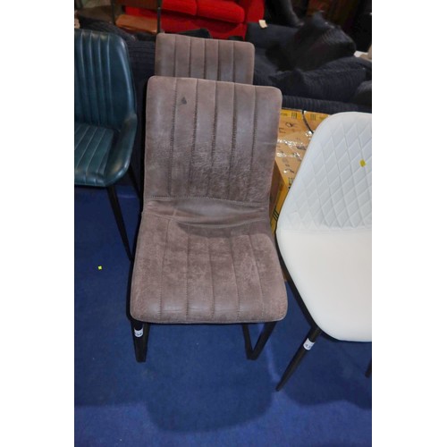 438 - 2 x dark upholstered cantilever dining chairs. Please note that one has a mark on the back fabric