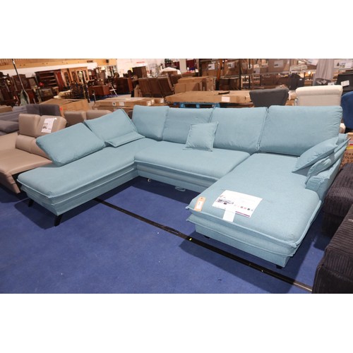 469 - A Miuform Charming Charlie aqua upholstered three part corner sofa with ottoman type chaise end that... 