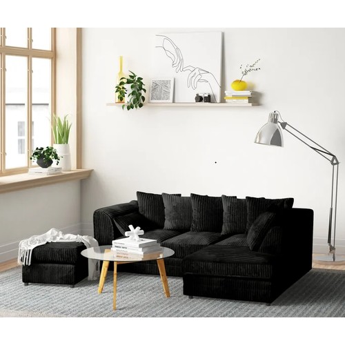 470 - A Zipcode Design Moana black upholstered two part corner chaise sofa with a matching foot stool RRP ... 