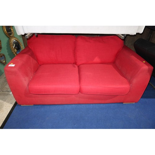 476 - A red upholstered two person sofa (no make visible) approx 180cm wide. Please note this sofa is used... 