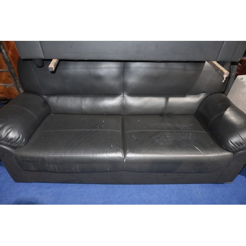 479 - 2 x black upholstered sofas. Please note that the two seater sofa has a tear in the upholstery (just... 