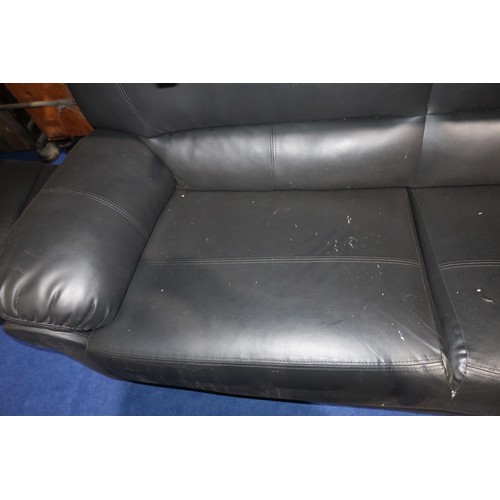 479 - 2 x black upholstered sofas. Please note that the two seater sofa has a tear in the upholstery (just... 