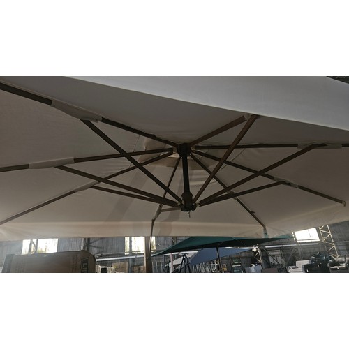 374 - A Bellefonte 4m x 3m rectangular cantilever parasol RRP £1799. Please note WINDER IS MISSING and no ... 