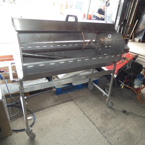 1010 - A tall commercial stainless steel mobile gas fired hog roast driven by a 12v  motor, approx 162x65x1... 