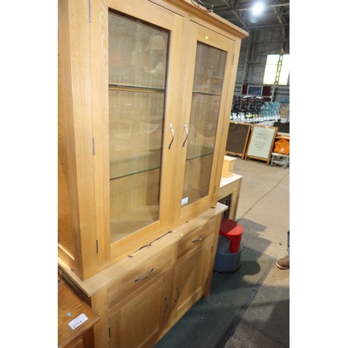 2115 - A light Oak two part sideboard / dresser with 2 glass doors above and 2 drawers / 2 doors below appr... 