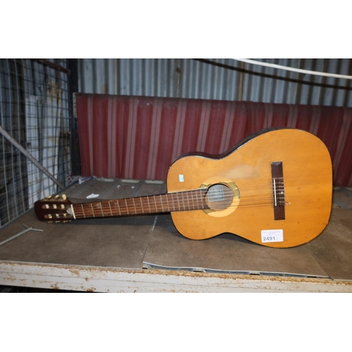 2491 - A 6 string acoustic guitar by Terada type 004