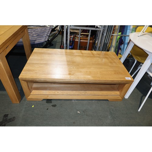 2170 - A light Oak coffee table with shelf below approx 130 x 70cm