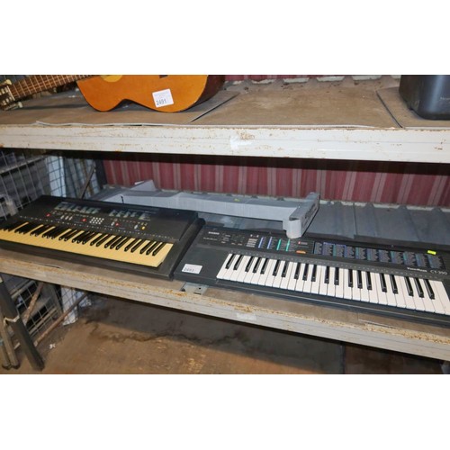 2493 - A Yamaha keyboard type PSR200 & a Casio keyboard type CT390, 1 keyboard stand included, no power ada... 