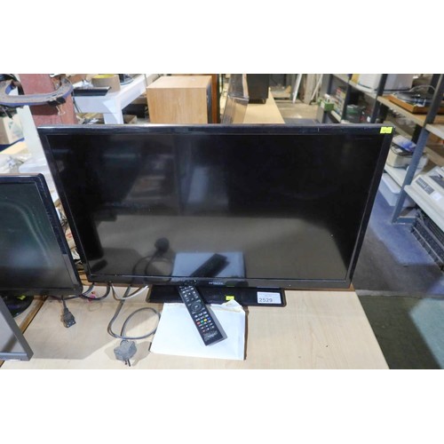 2529 - A 32 inch HDTV by Hitachi type 32HXC01U with remote control and stand - trade