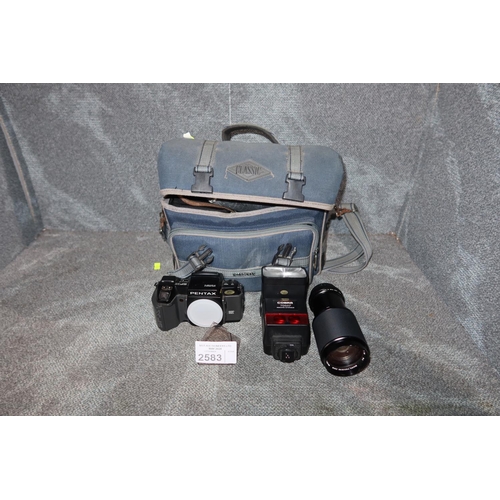 2583 - A 35mm camera by Pentax type SFX, comes with a lens, flash and soft carry bag - trade