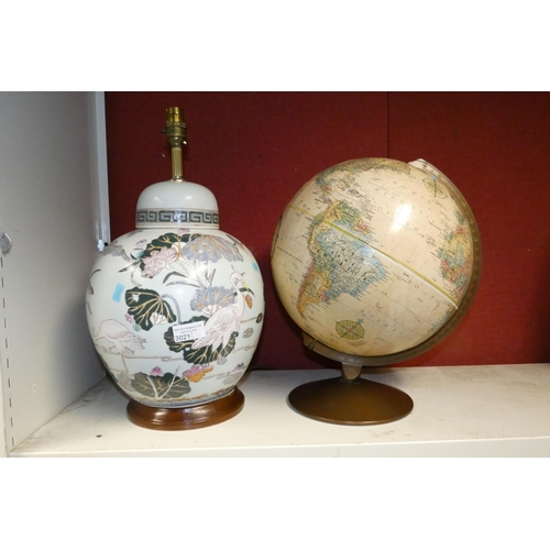 3021 - A Chinese ceramic table lamp and a vintage globe of the world