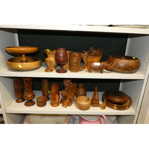 3045 - A quantity of miscellaneous decorative wooden bowls, pots and carved ornaments etc (two shelves)