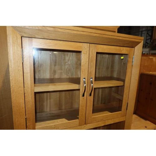 2119 - A light Oak two part sideboard /dresser with 2 x glass doors above and 2 drawers / 2 doors below app... 