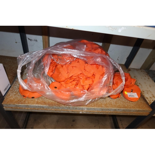 2643 - A large quantity of orange straps, contents of 1 shelf