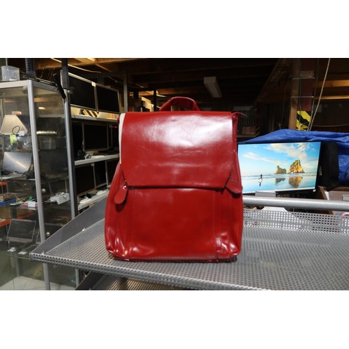 2219 - 1 x Nicole and Doris burgundy hand bag / back pack