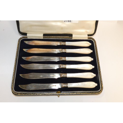A boxed set of six silver fruit knives with mother of pearl handles, Sheffield 1926