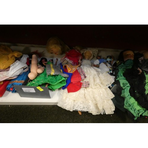 3019 - A collection of decorative souvenir dolls (one shelf)