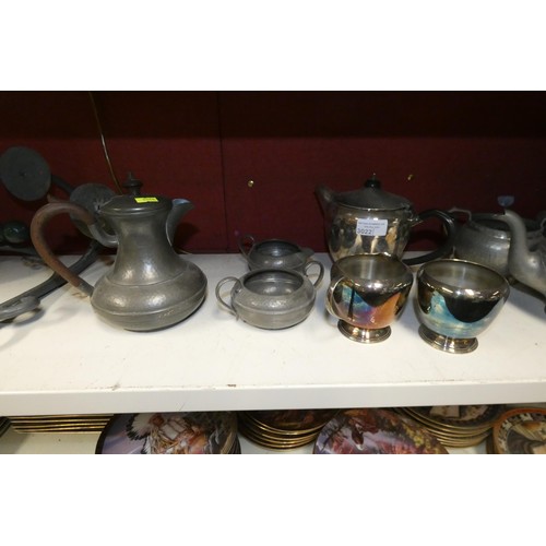 3022 - Two decorative pewter three-piece tea sets, a silver plated three-piece tea set and two metal bracke... 