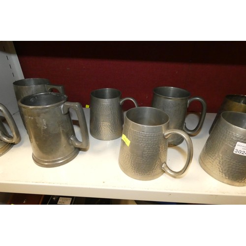 3024 - A quantity of decorative pewter and other tankards