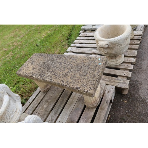 2672 - A weathered concrete garden bench